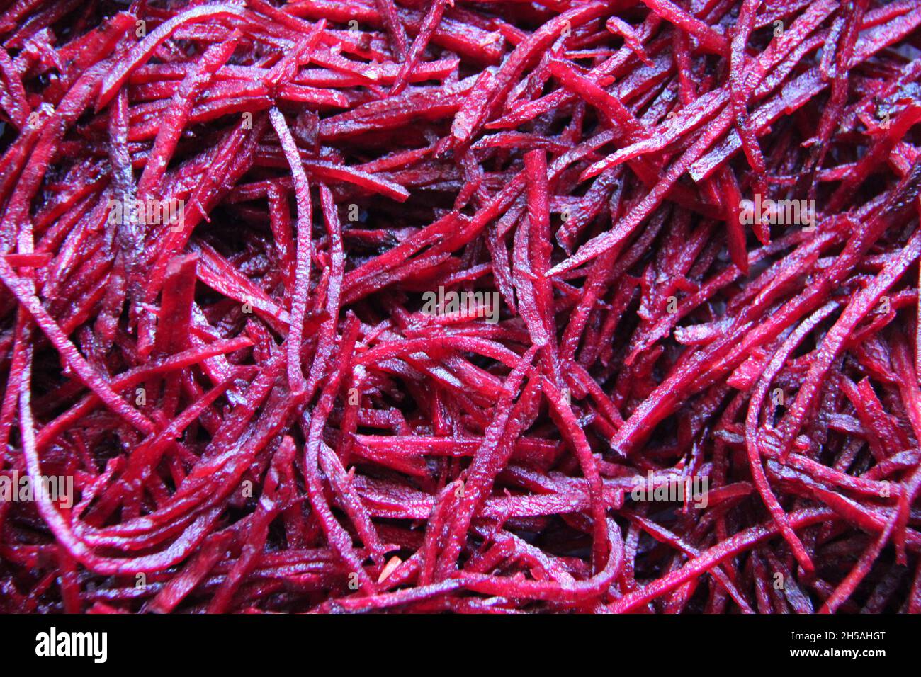 Grated beets, close-up, full screen, backgrounds and textured. Stock Photo