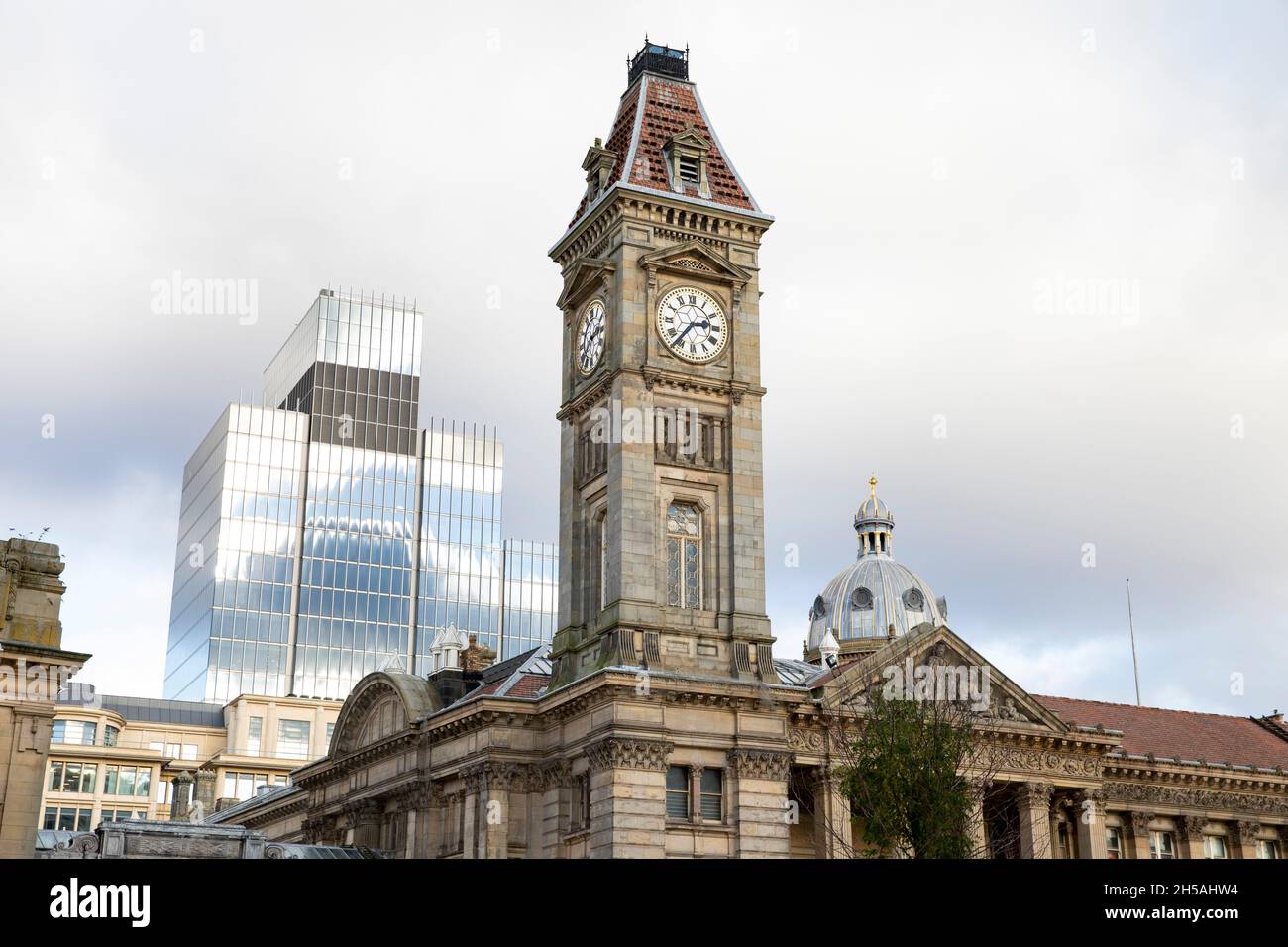 The almost complete 103 Colmore Row building pictured behind behind the Birmingham Museum and art gallery clock in Chamberlain Square. Stock Photo