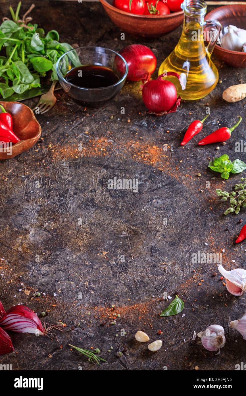 Culinary background with kitchen stone surface, olive oil in a jug and ...