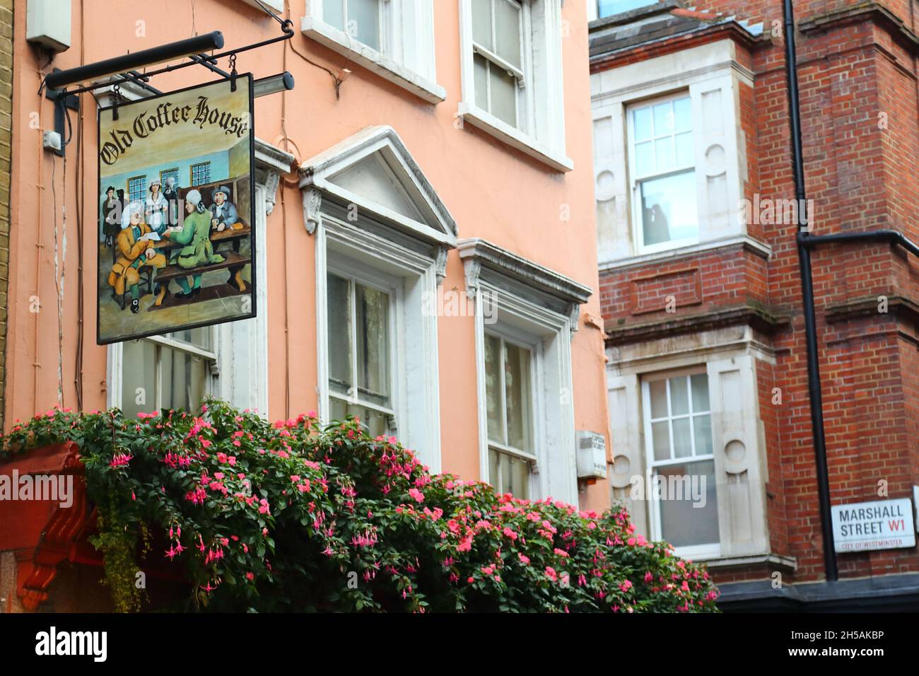 sign-and-flower-baskets-above-the-old-coffee-house-in-soho-lomdon-uk