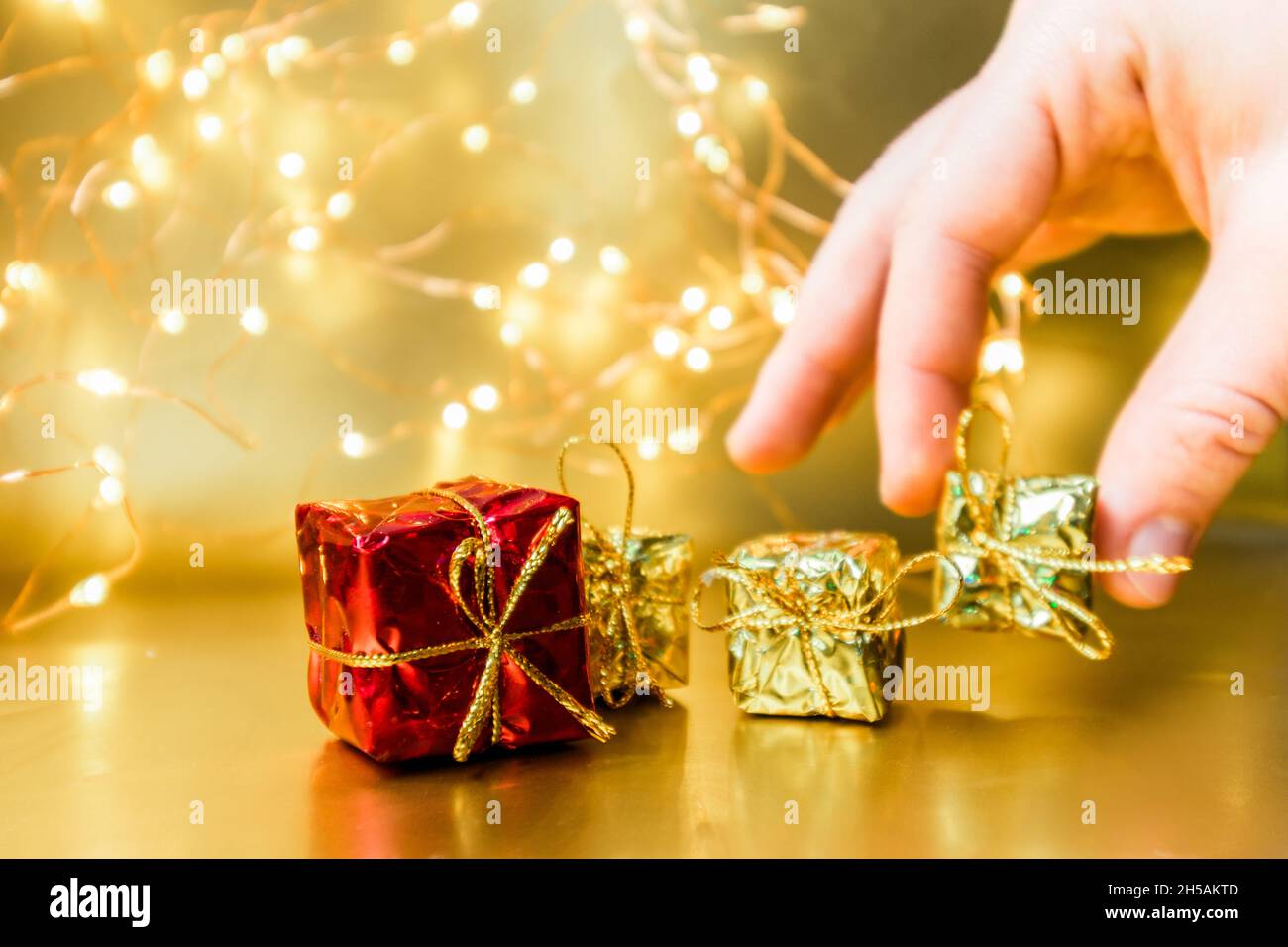 Christmas gold background with gifts. New Year presents. Stock Photo