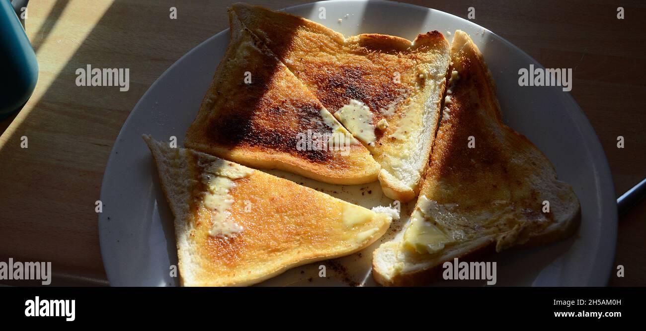 toasted white bread with butter Stock Photo Alamy
