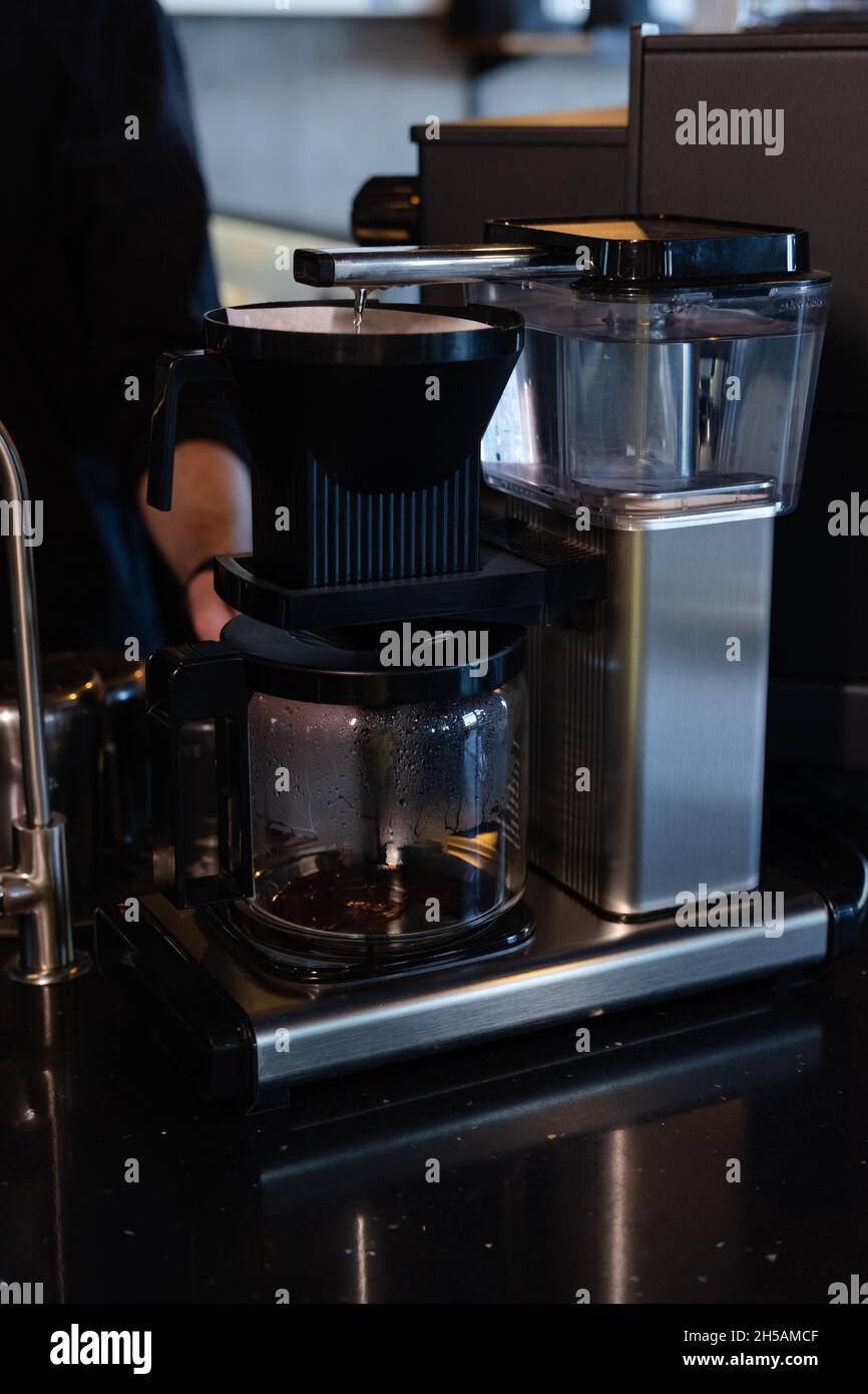 Coffee maker with glass jug of coffee 