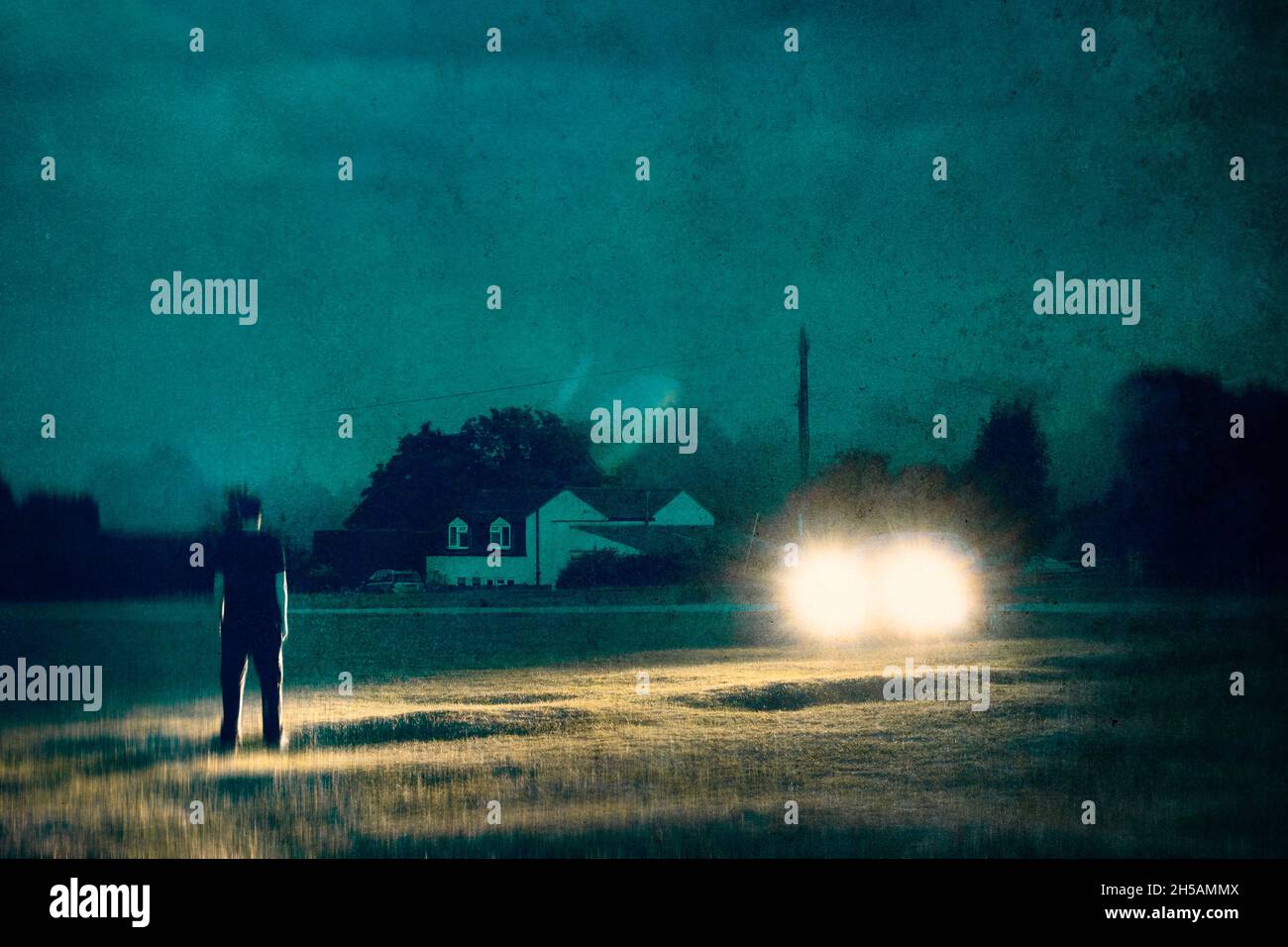 Man standing in front headlights hires stock photography and images