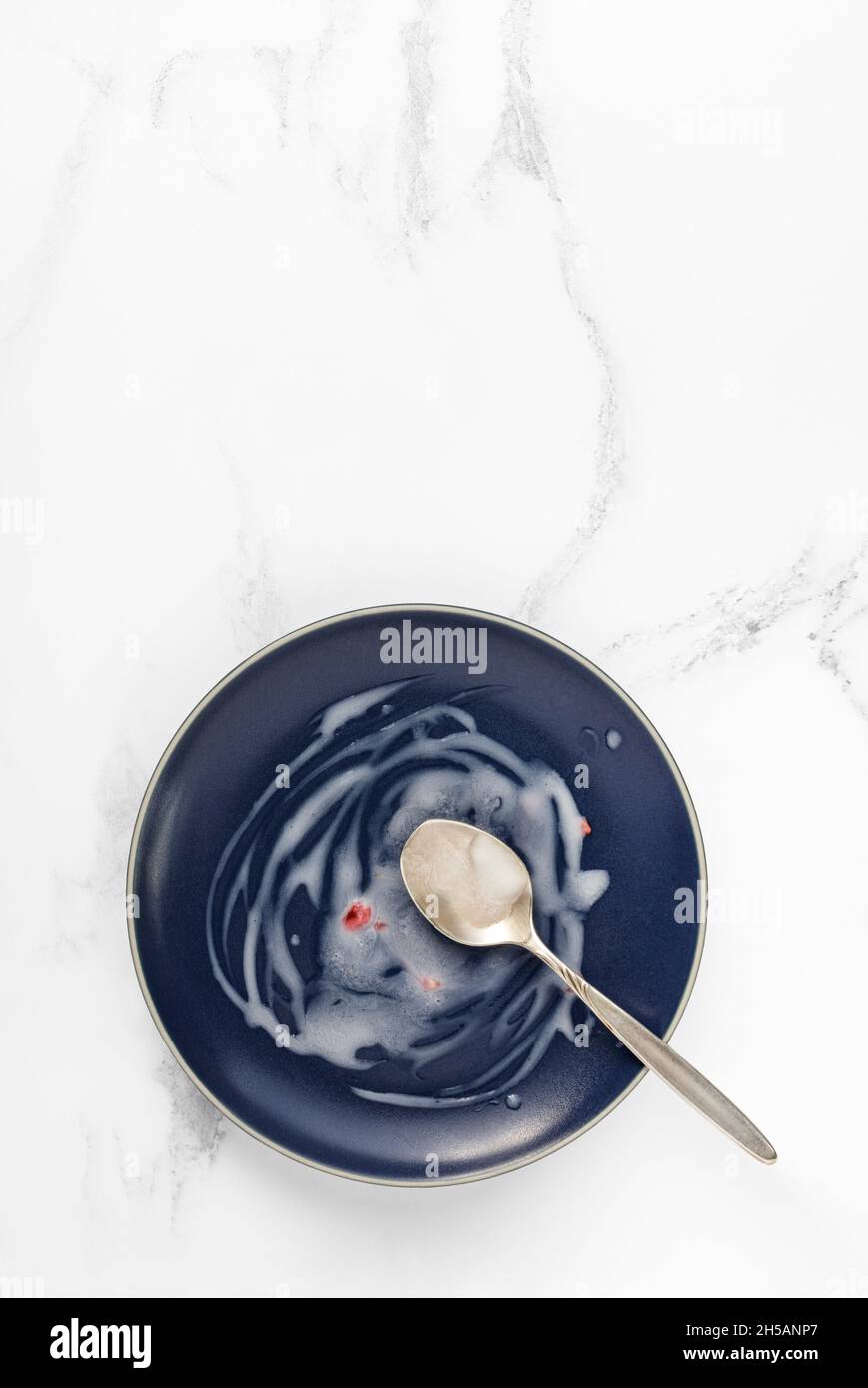 Empty blue plate on white marble Stock Photo