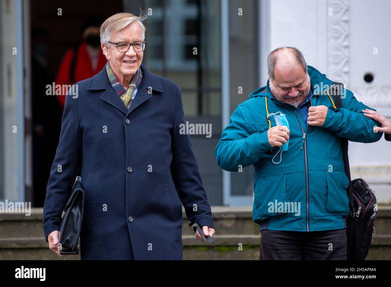 Mecklenburg-Western Pomerania, Schwerin, 08 November 2021,  Schwerin, Germany. 08th Nov, 2021. Dietmar Bartsch (l), chairman of the Left party's parliamentary group in the Bundestag, and Peter Ritter (r), a participant in the Left party's negotiating group, walk to a final meeting during coalition negotiations between the SPD and the Left party in Mecklenburg-Western Pomerania. The coalition agreement for red-red in Mecklenburg-Western Pomerania is ready, Schwesig tweeted earlier. The negotiators Schwesig and Oldenburg want to present the contract publicly later. Credit: Jens Büttner/dpa-Zentr Stock Photo