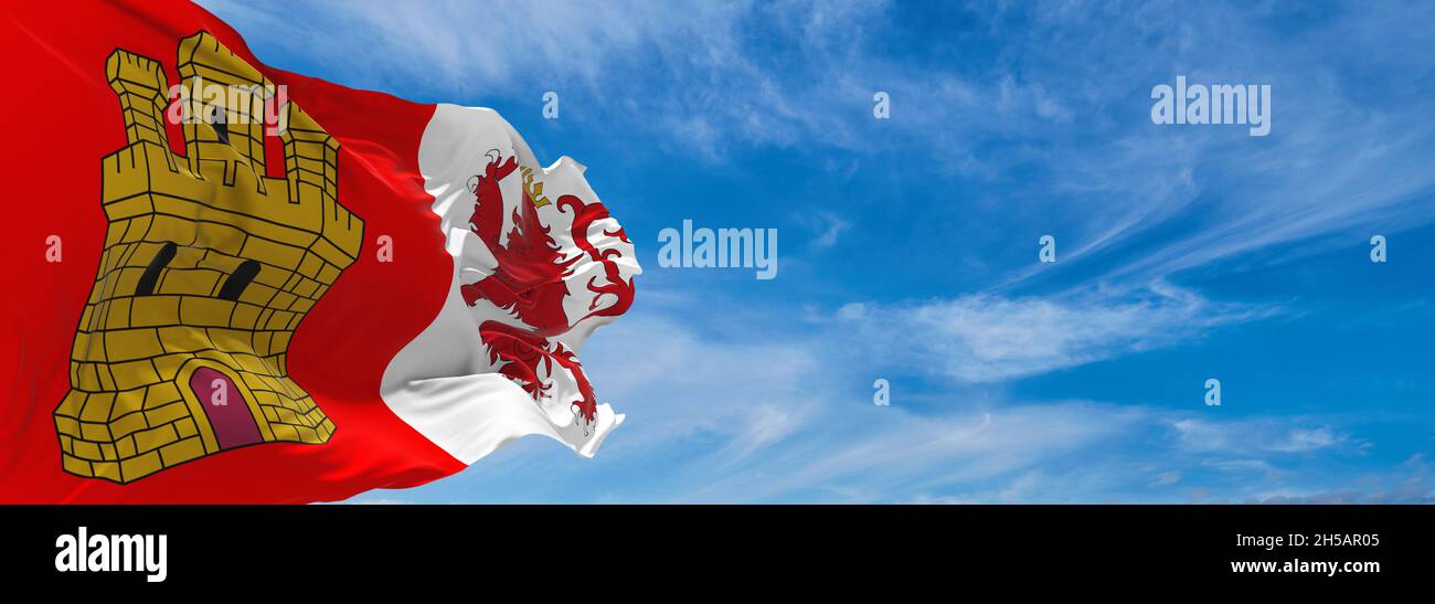 flag of Caceres , Spain at cloudy sky background on sunset, panoramic ...