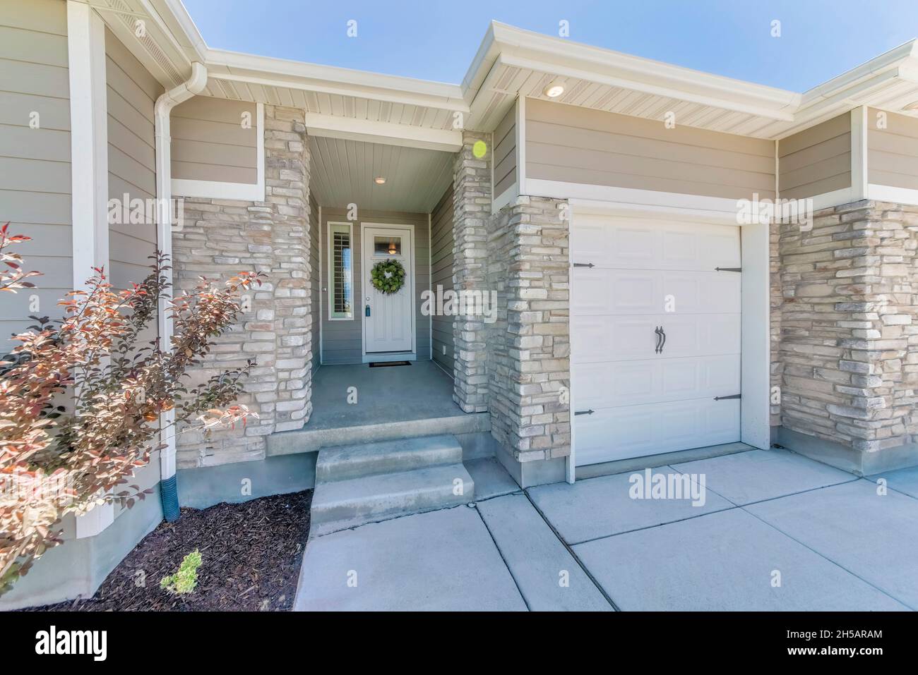 Traditional contemporary house exterior with side hinged garage Stock Photo