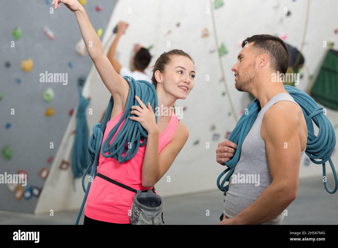 Concentrated man woman climbing hi-res stock photography and images - Alamy