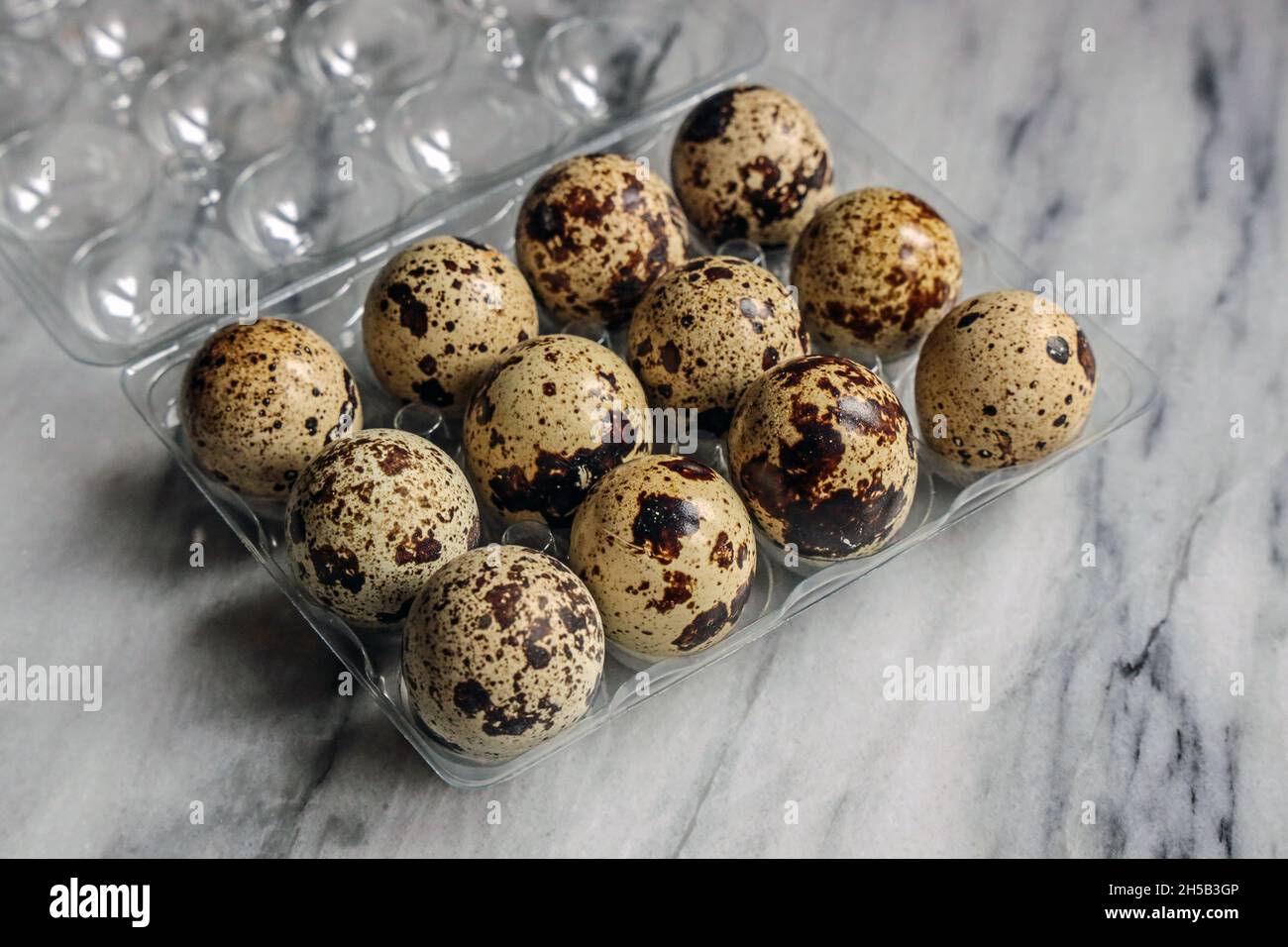 A dozen quails eggs Stock Photo Alamy