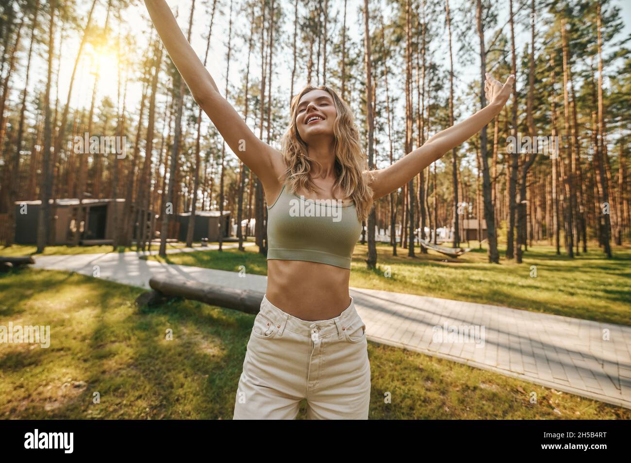 Standing woman hands waist hi-res stock photography and images - Alamy