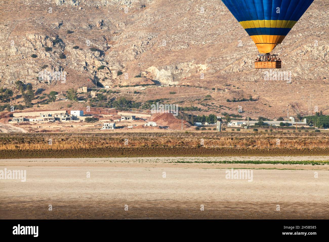 Hot air balloon photographed in the Jezreel Valley, Israel Mount Gilboa in the background Stock Photo
