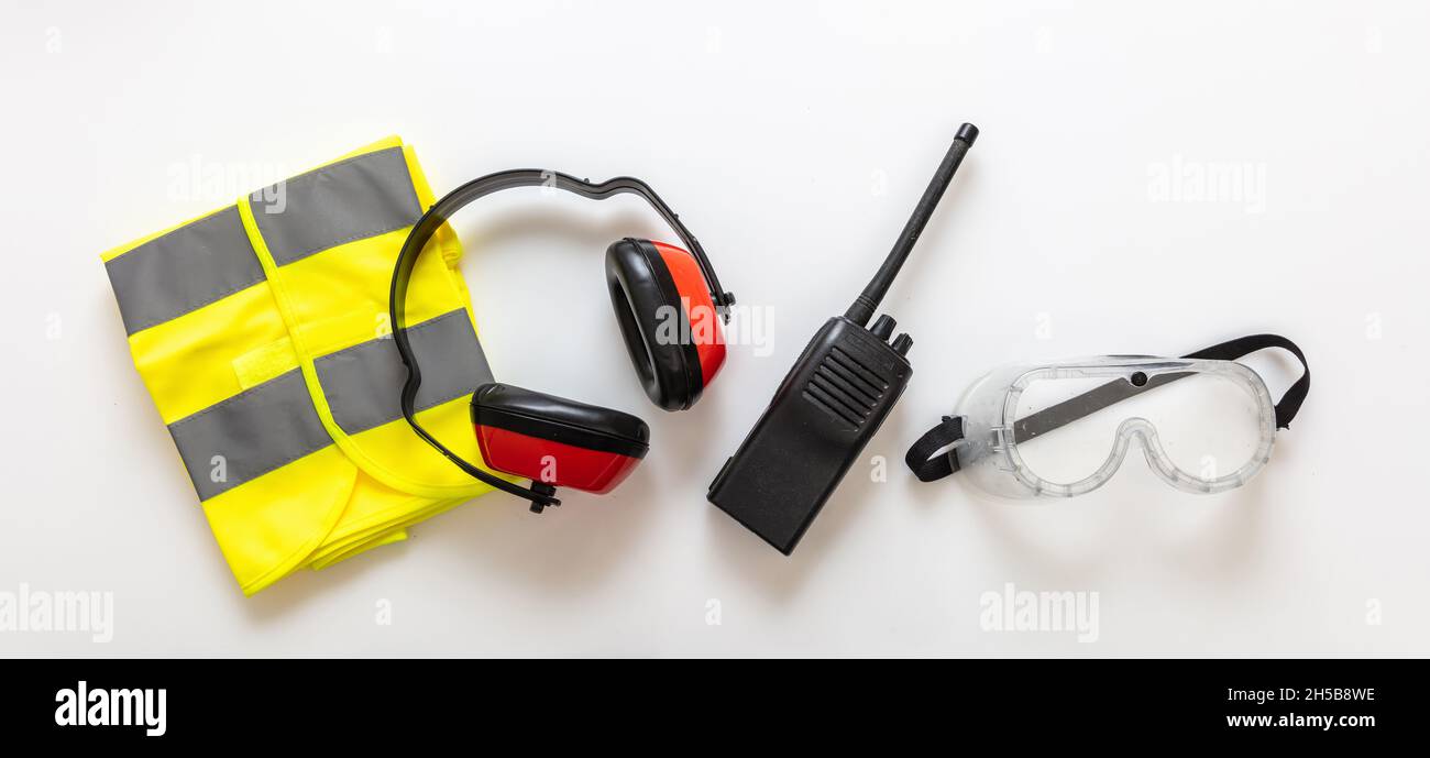 Safety health worker gear. Work wear protection isolated on white background, Personal protective and communication equipment, top view Stock Photo