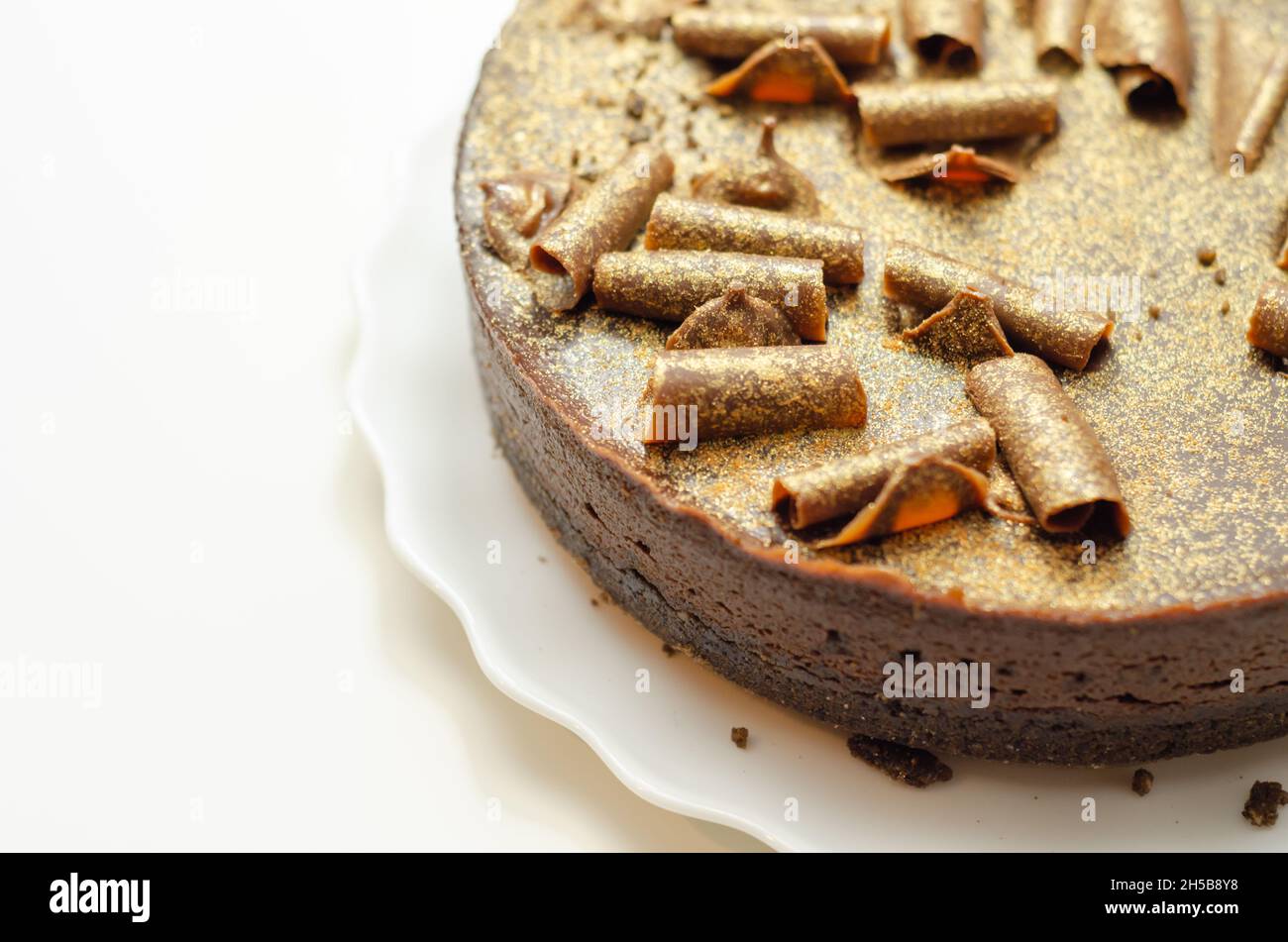 Digestive biscuit base with chocolate cheesecake and pockets of salted caramel sauce, topped