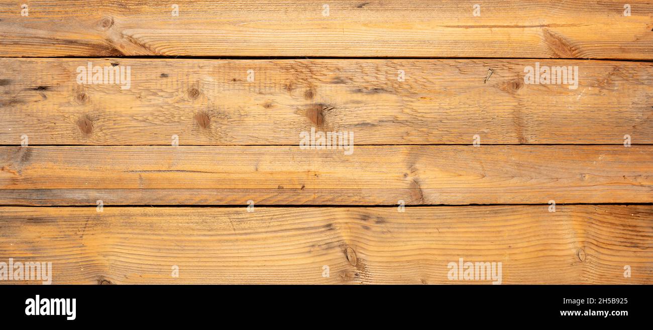 Wood background, texture. Rustic weathered barn wood background with knots and nail holes. Rough wooden planks board, banner Stock Photo