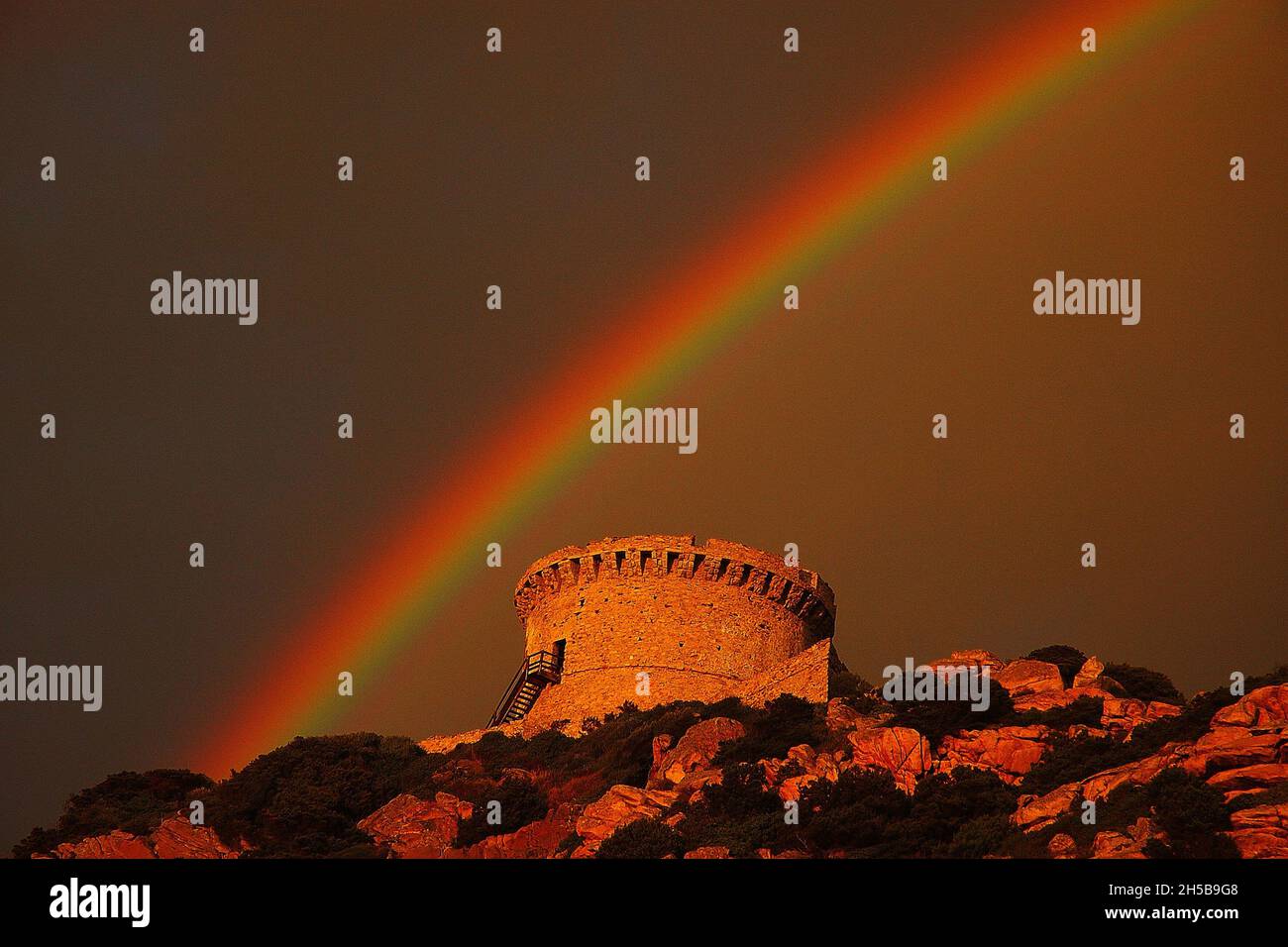 RAIINBOW ON GENOISE TOWER OF CAMPOMORO (XVIEME SIECLE), CORSE DU SUD (2A) FRANCE Stock Photo