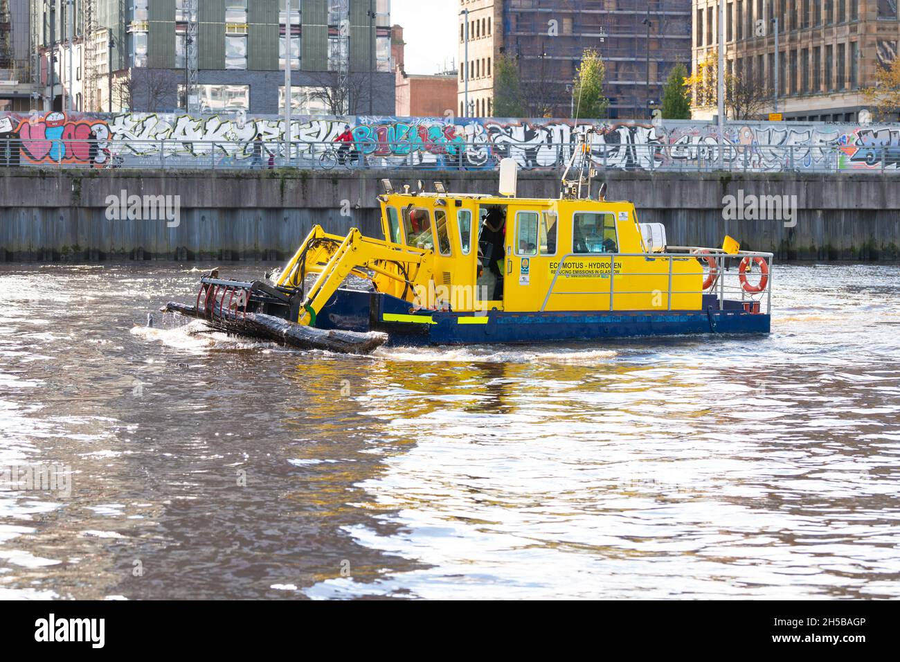 Water Witch 'St Mungo' with Ecomotus hydrogen EcoPro Electrolyser installed to reduce its emissions while cleaning up the Clyde, Glasgow, Scotland UK Stock Photo