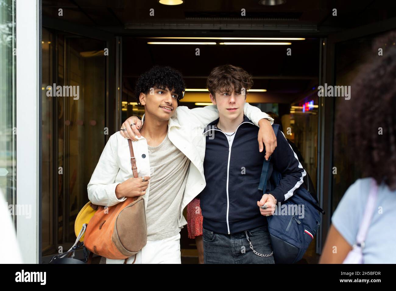 Two boys arms around hi-res stock photography and images - Alamy