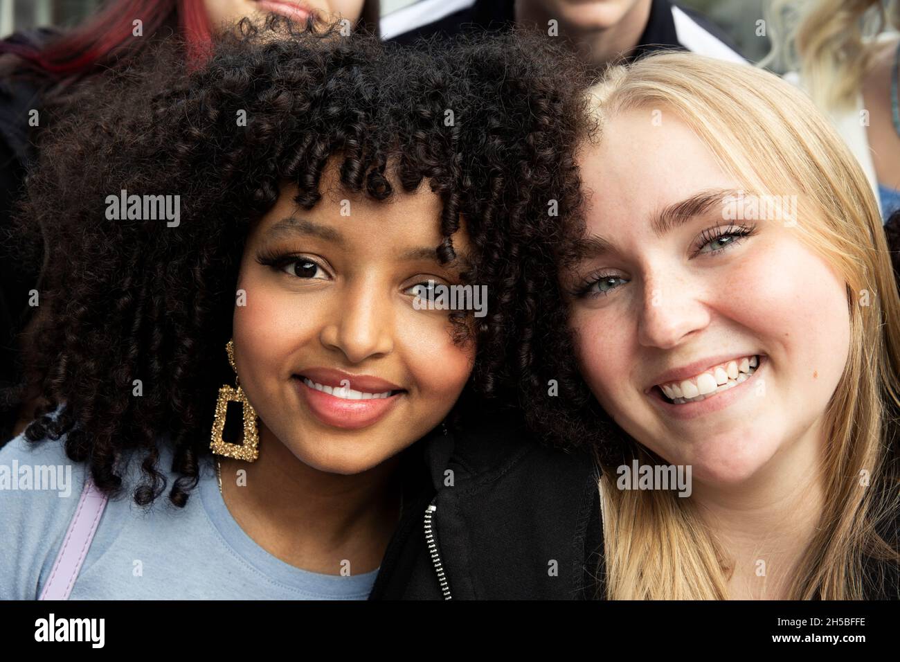 Portrait of smiling female friends together Stock Photo