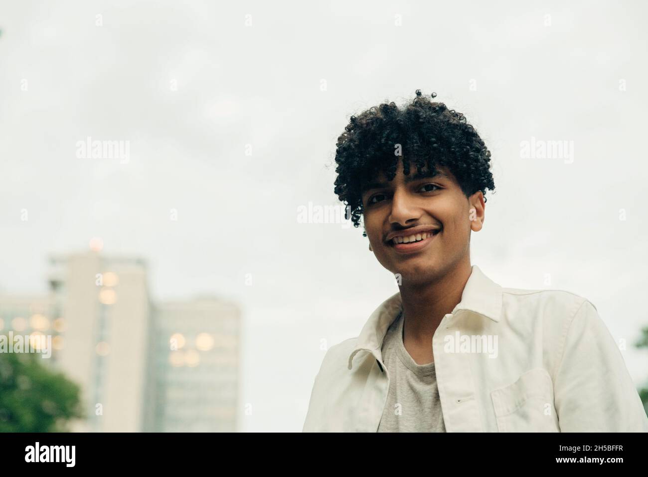 Happy teenage boy smiling hi-res stock photography and images - Alamy
