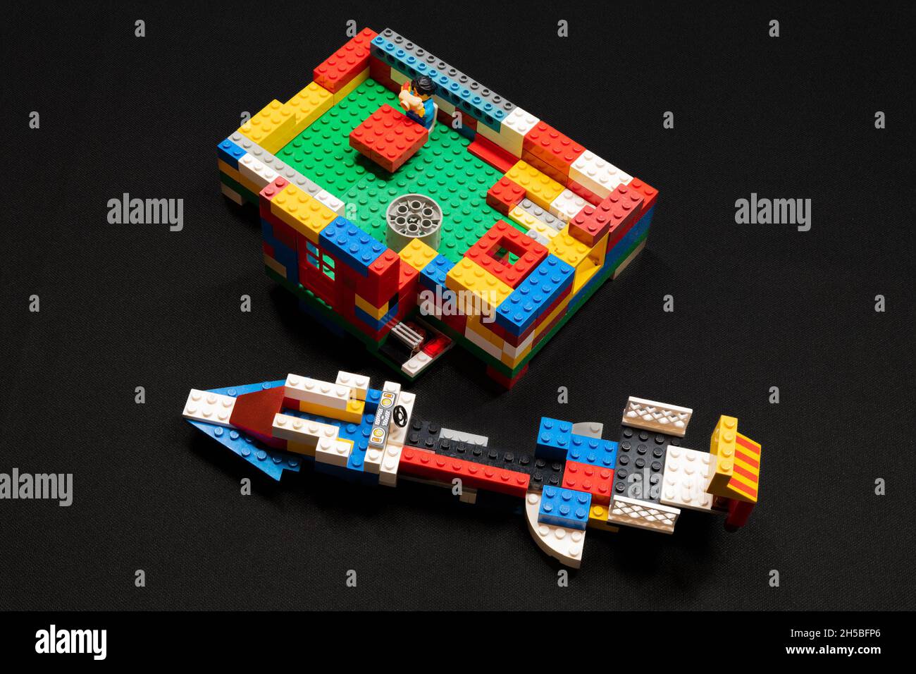 Irvine, Scotland, UK - November 07,  2021: Children’s lego branded plastic brick set partially assembled with bricks of varying colour shapes and size Stock Photo