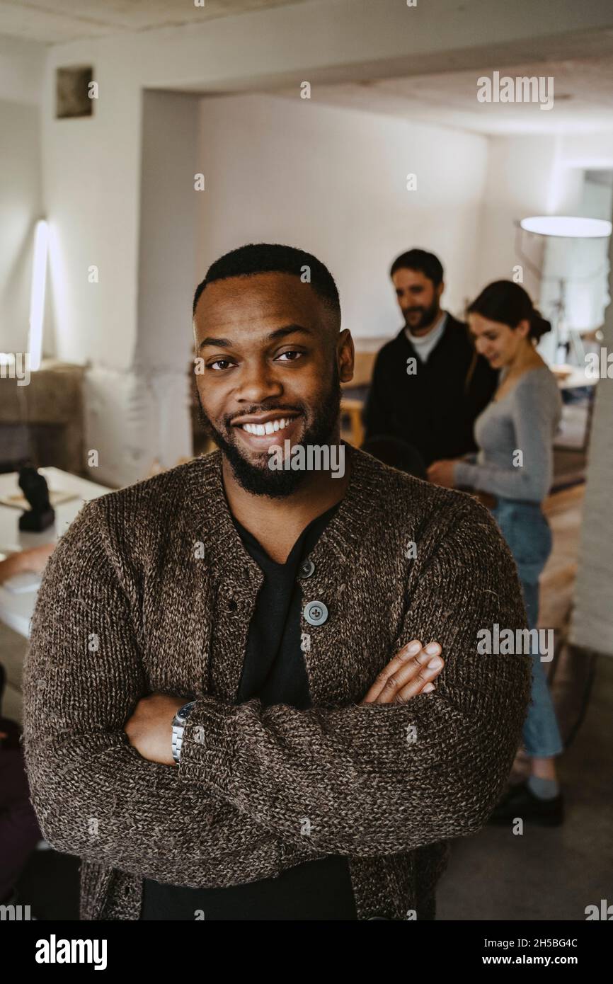 Smiling male professional arms hi-res stock photography and images - Alamy