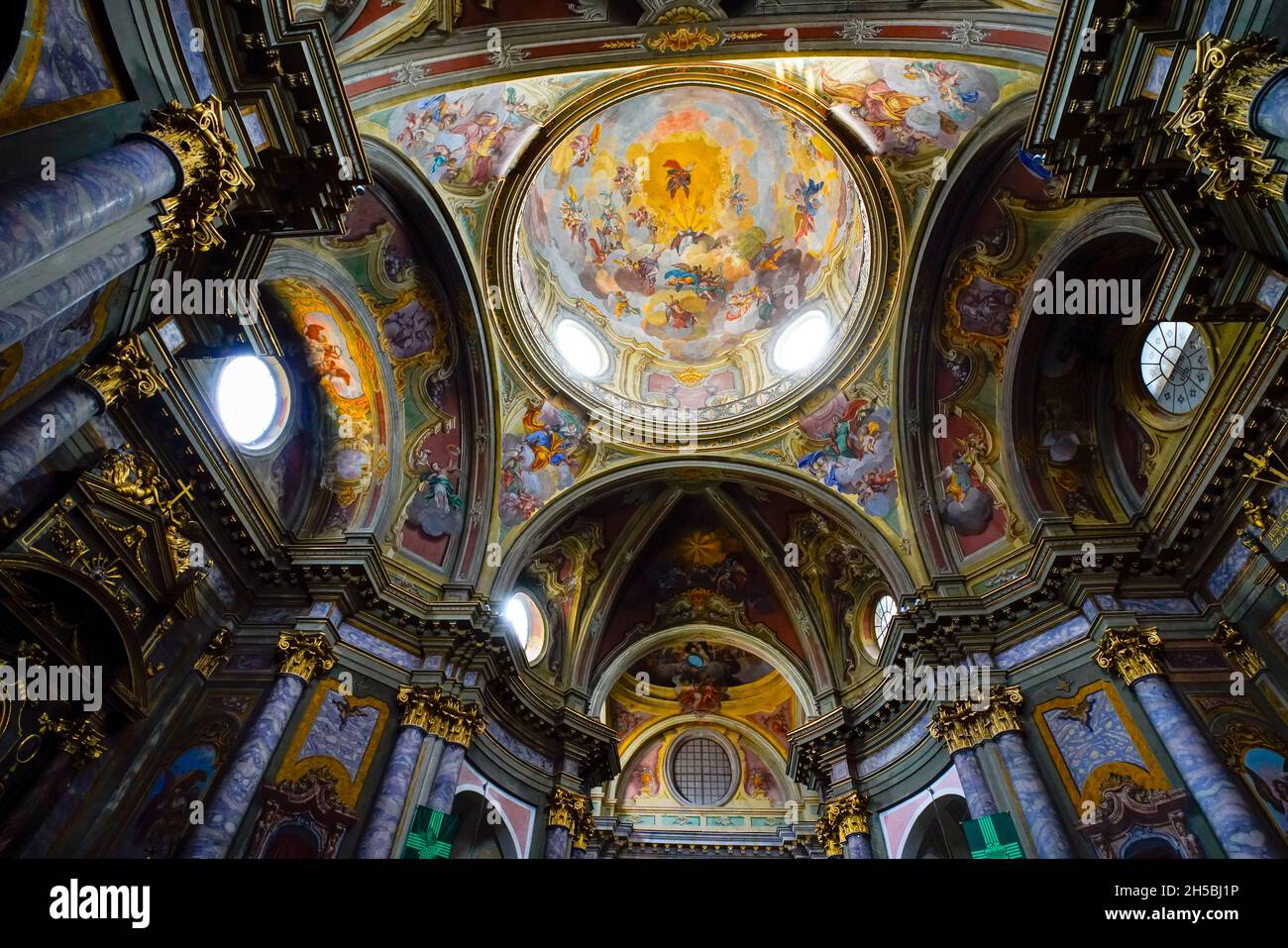 Inside St. Ambrogio church in Cuneo. The Capital city of  Cuneo province, Piedmont region, Italy. The  Dome decorated by a painting realised by Michel Stock Photo