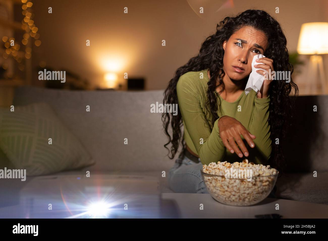 Depressed Woman Crying Watching Sad Movie Wiping Tears At Home Stock Photo
