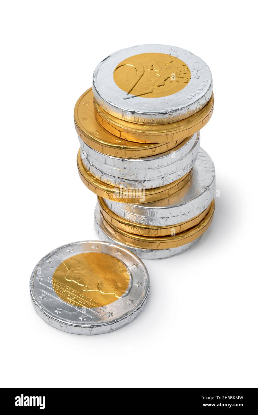 Pile of golden and silver chocolate coins for the celebration of Sint Nicolaas close up on white background Stock Photo