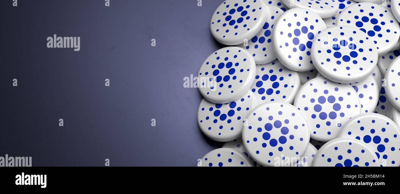 Logos of the cryptocurrency Cardano (ADA) on a heap on a table. Copy space.  Web banner format Stock Photo - Alamy