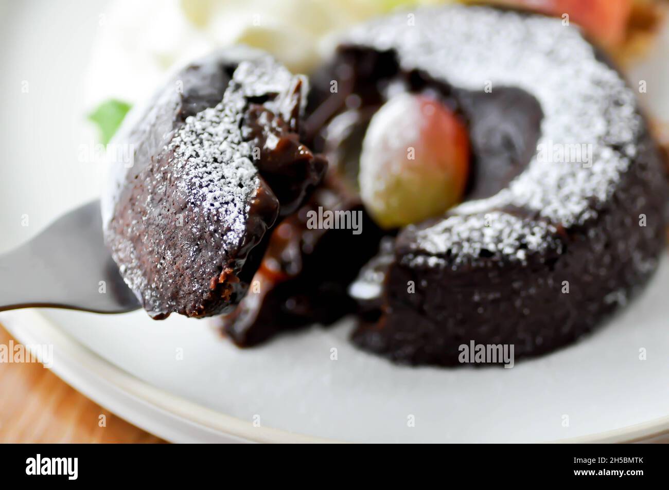 chocolate cake or chocolate lava cake with ice cream and fruit for