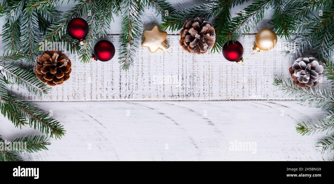 Christmas background with fir branches,pinecones and berries on the old ...