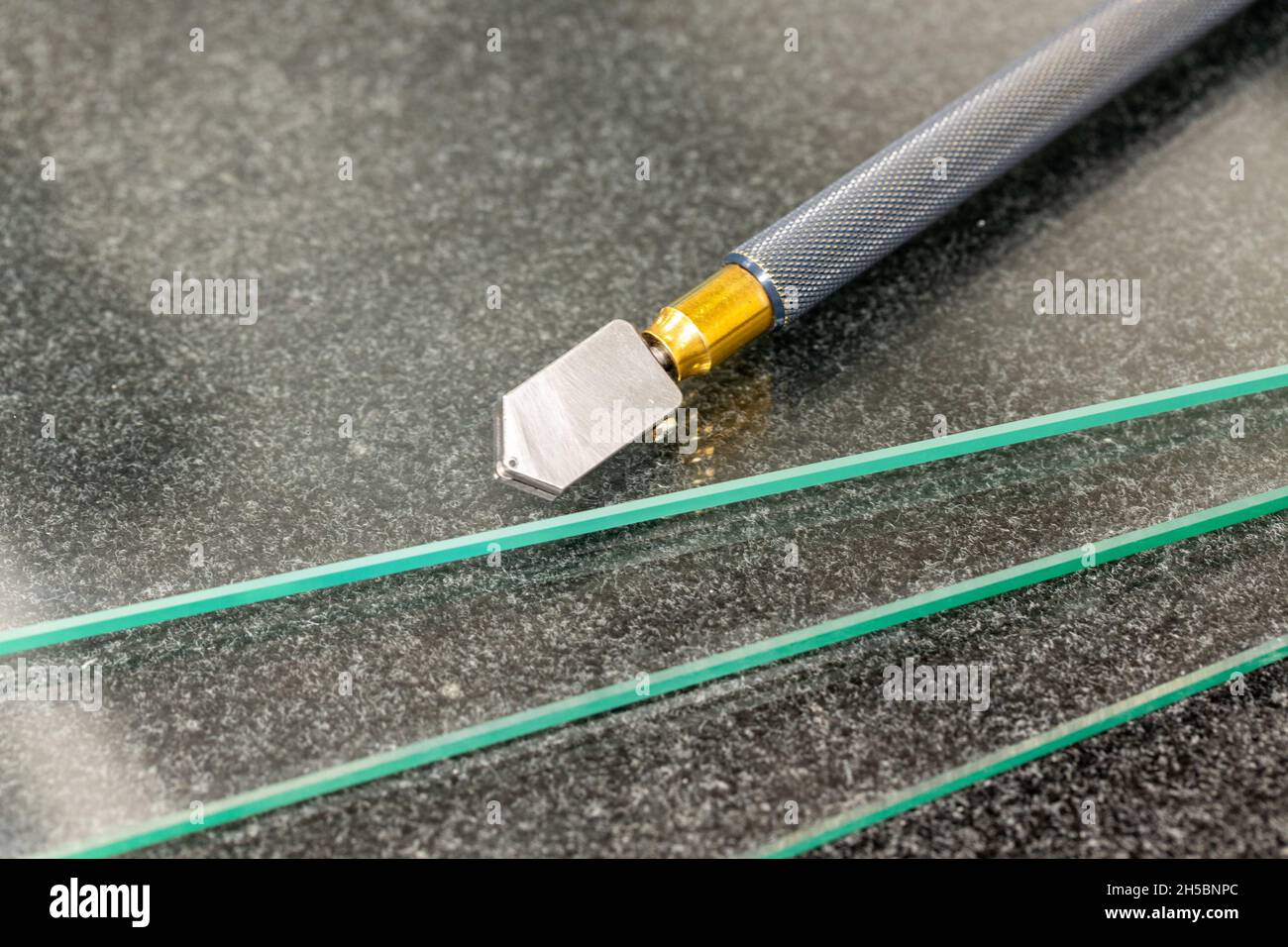 glass cutting tool, lying glass panes Stock Photo Alamy