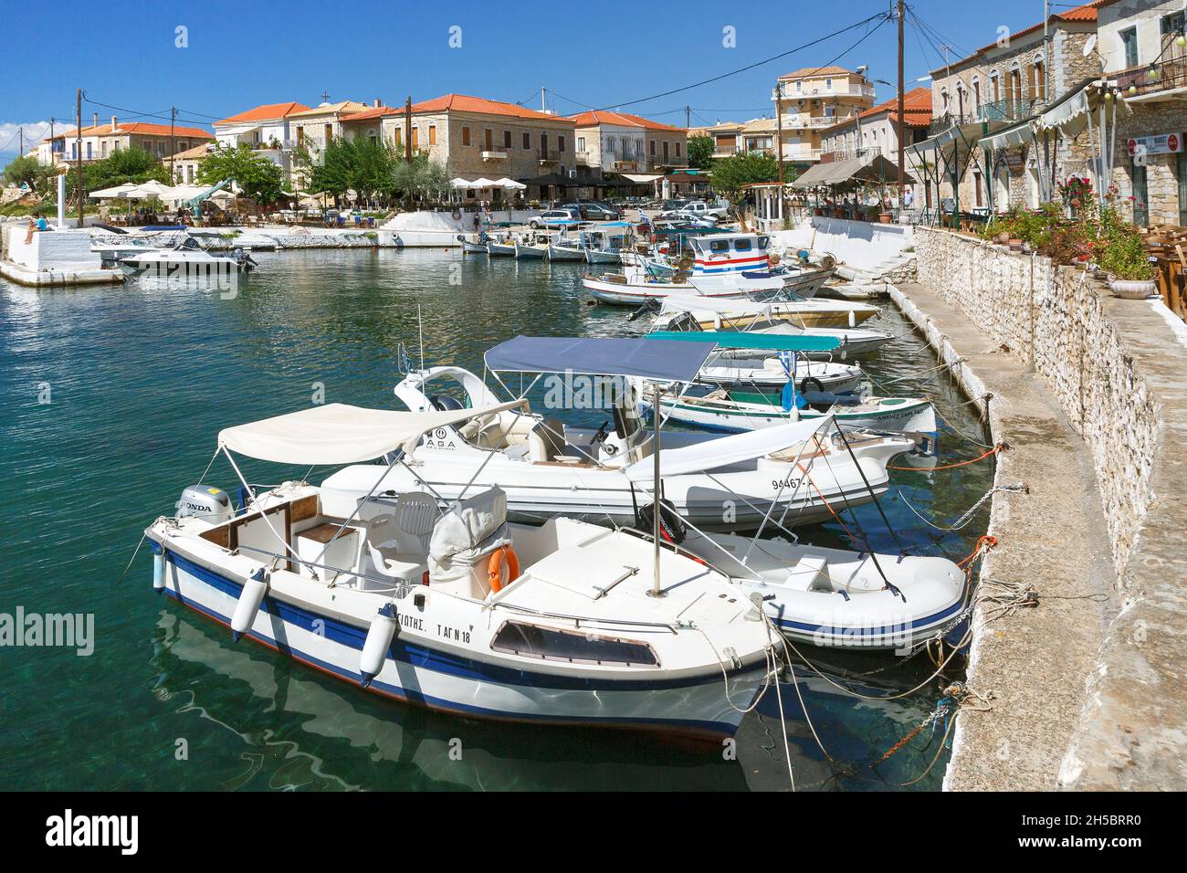 Fishing boats in the harbour of Agios Nikolaos near Stoupa on the Mani peninsula of the Southern Peloponnese of Greece Stock Photo