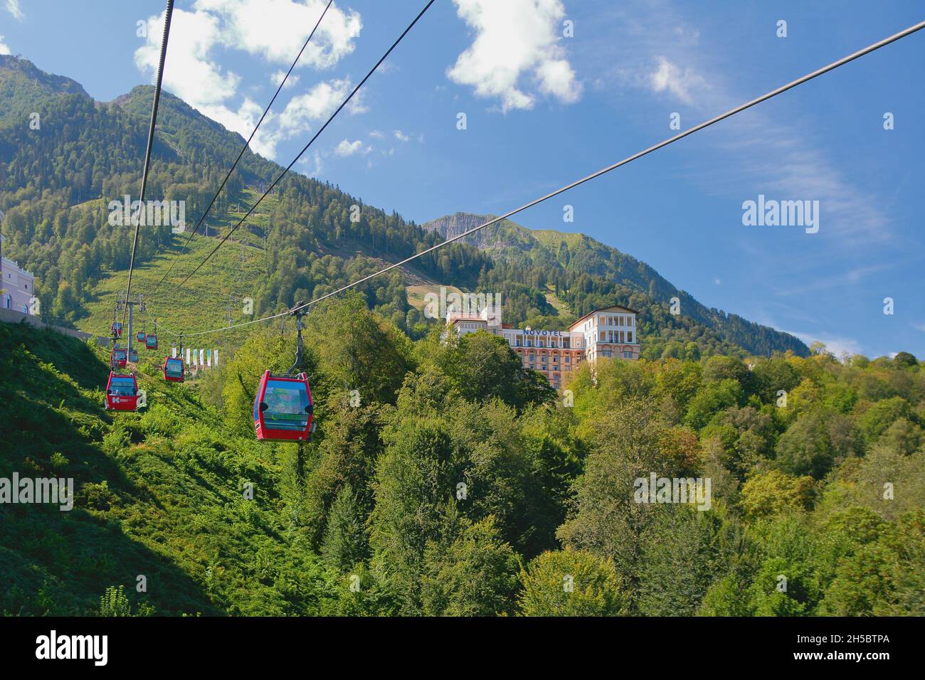 Esto-Sadok, Sochi, Russia - Sep 04, 2021: Cable car and hotel in mountains, resort Krasnaya Polyana Stock Photo