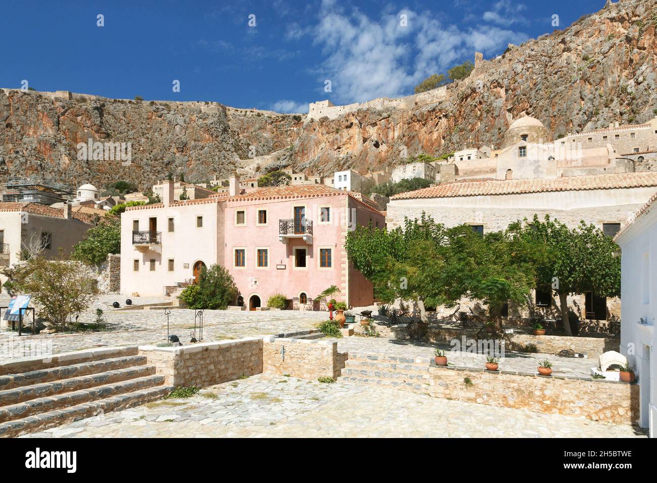 View upwards from the large square in the fortified town of Monemvasia in Laconia in the southern Peloponnese of Greece Stock Photo