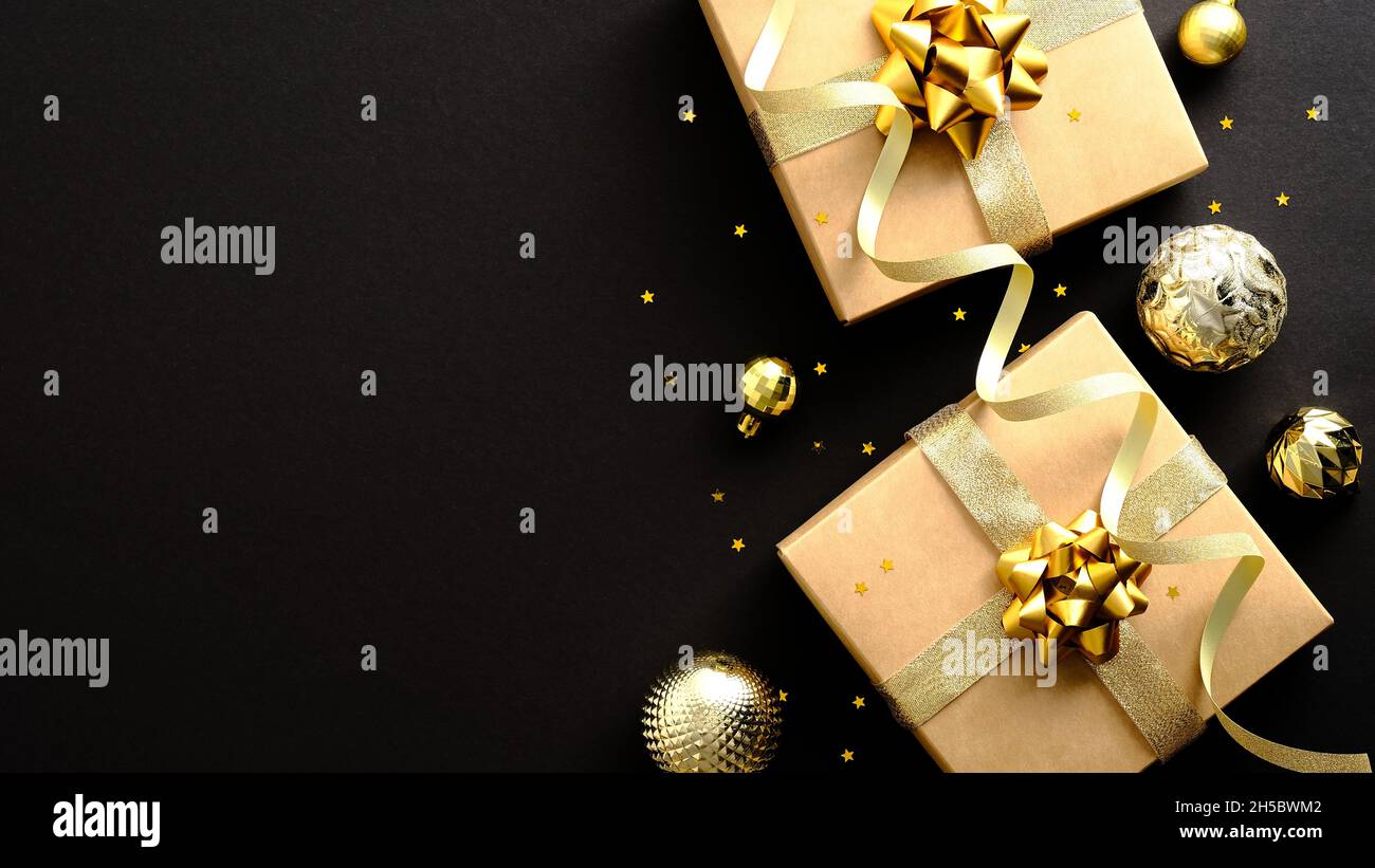 Luxury Christmas banner design. Flat lay gift boxes with golden ribbon