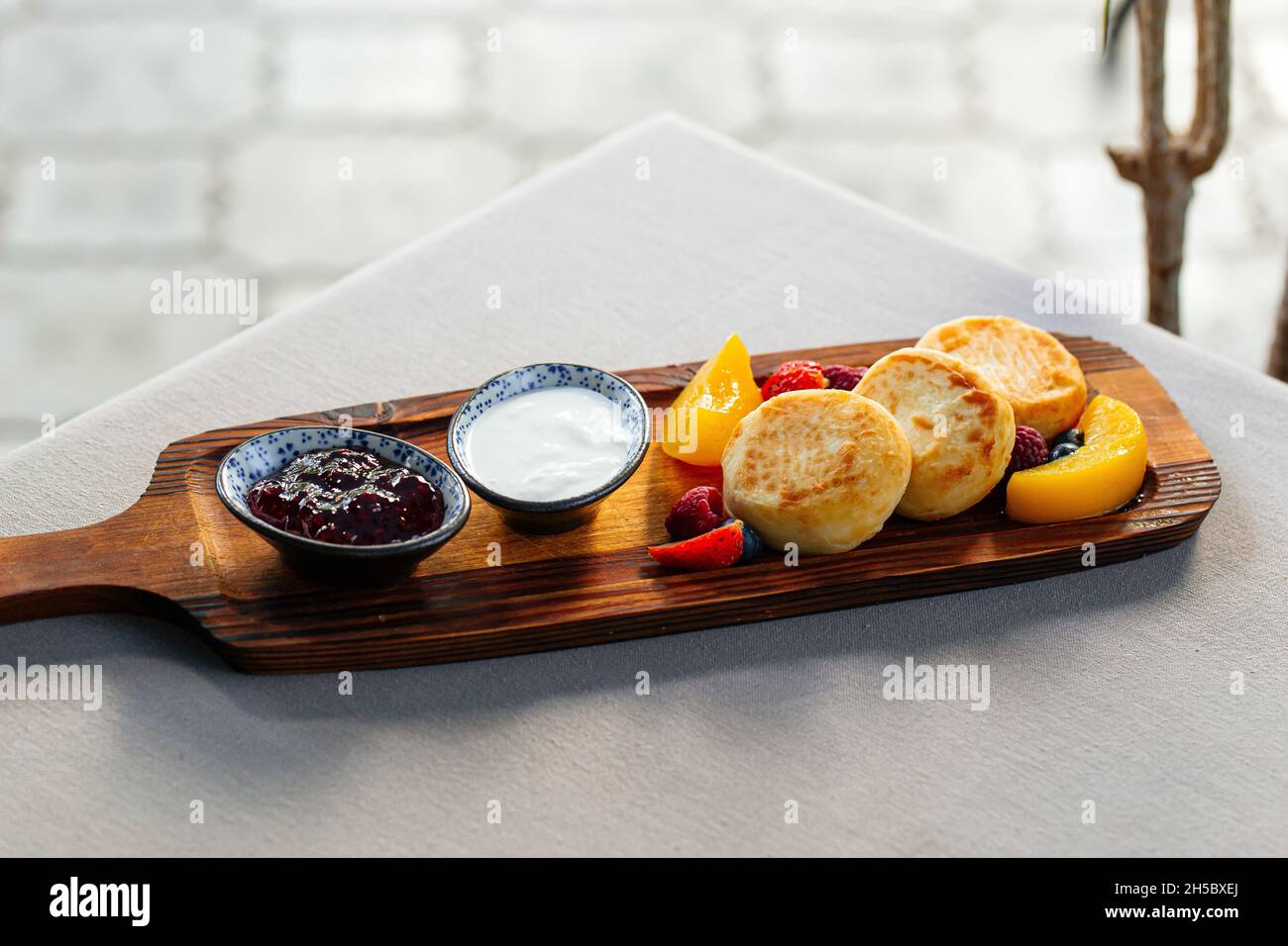 Tasty traditional russian breakfast of pancakes with honey on plate. Rustic  style. Stock Photo by ©Svetlana_Cherruty 151382336