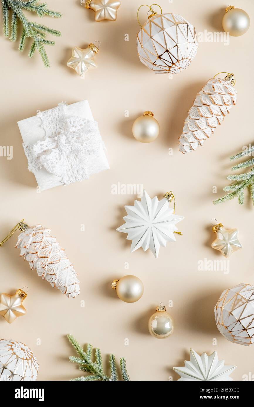 Christmas flat lay composition. Boho style balls, stars, pine cones  decorations on beige background Stock Photo - Alamy