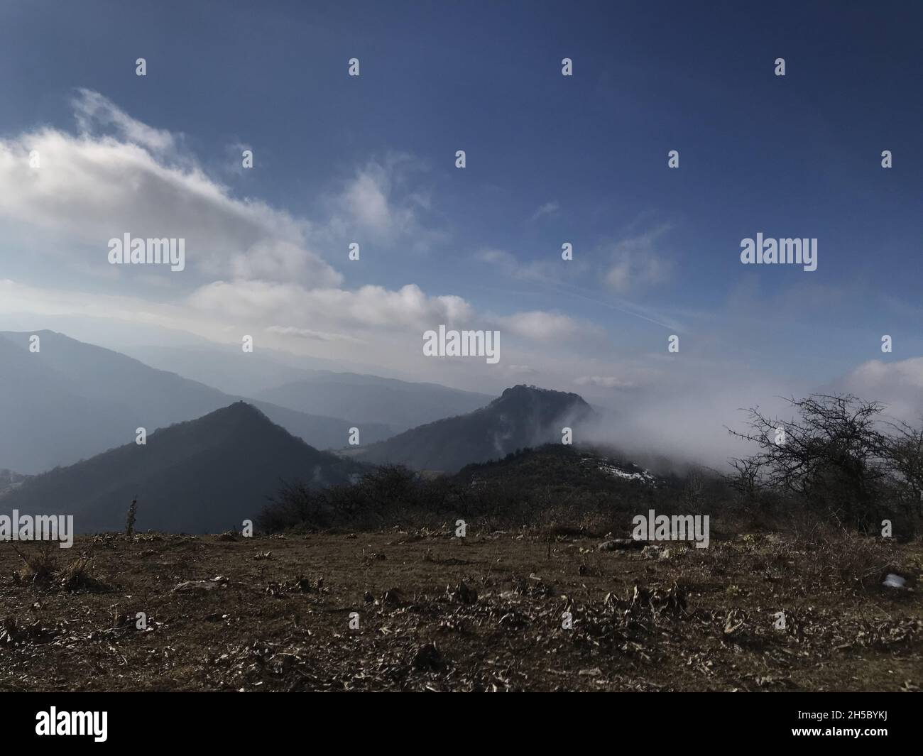 Beautiful shot of mountains on a foggy day Stock Photo - Alamy
