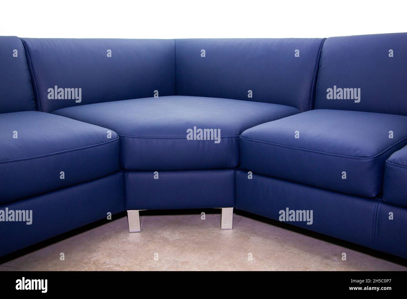 Corner folding sofa upholstered in leatherette, insulated on a white