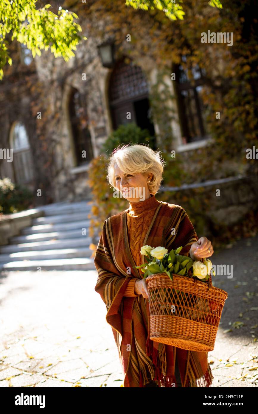 Mature woman alone walking park hi-res stock photography and images - Alamy