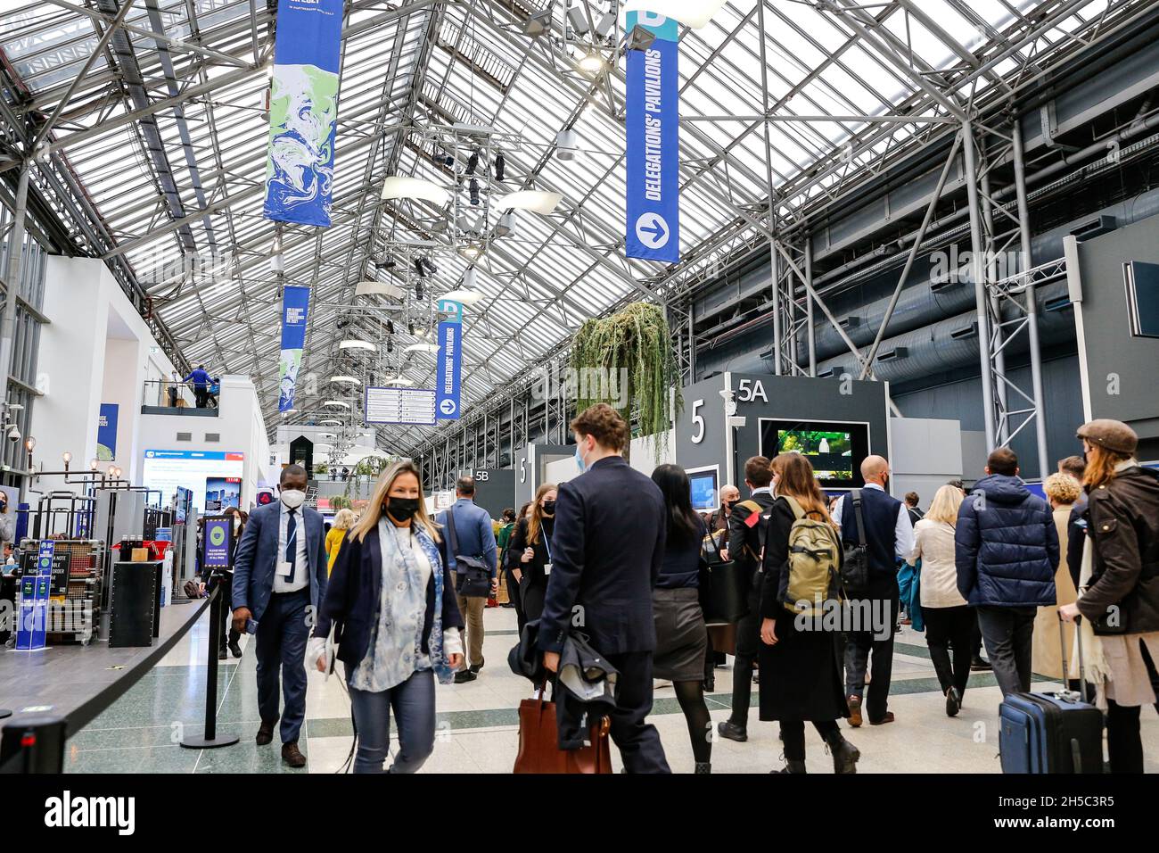 Glasgow, UK. 08th Nov, 2021. Participants walk in a common area during the eighth day of the COP26 UN Climate Change Conference, held by UNFCCC inside the COP26 venue - Scottish Event Campus in Glasgow, Scotland on November 8, 2021. COP26, running from October 31 to November to 12 in Glasgow, is the most significant climate conference since the 2015 Paris summit as the nations are expected to set new greenhouse gas emission targets in order to slow the global warming, as well as firming up other key commitments. (Photo by Dominika Zarzycka/Sipa USA) Credit: Sipa USA/Alamy Live News Stock Photo