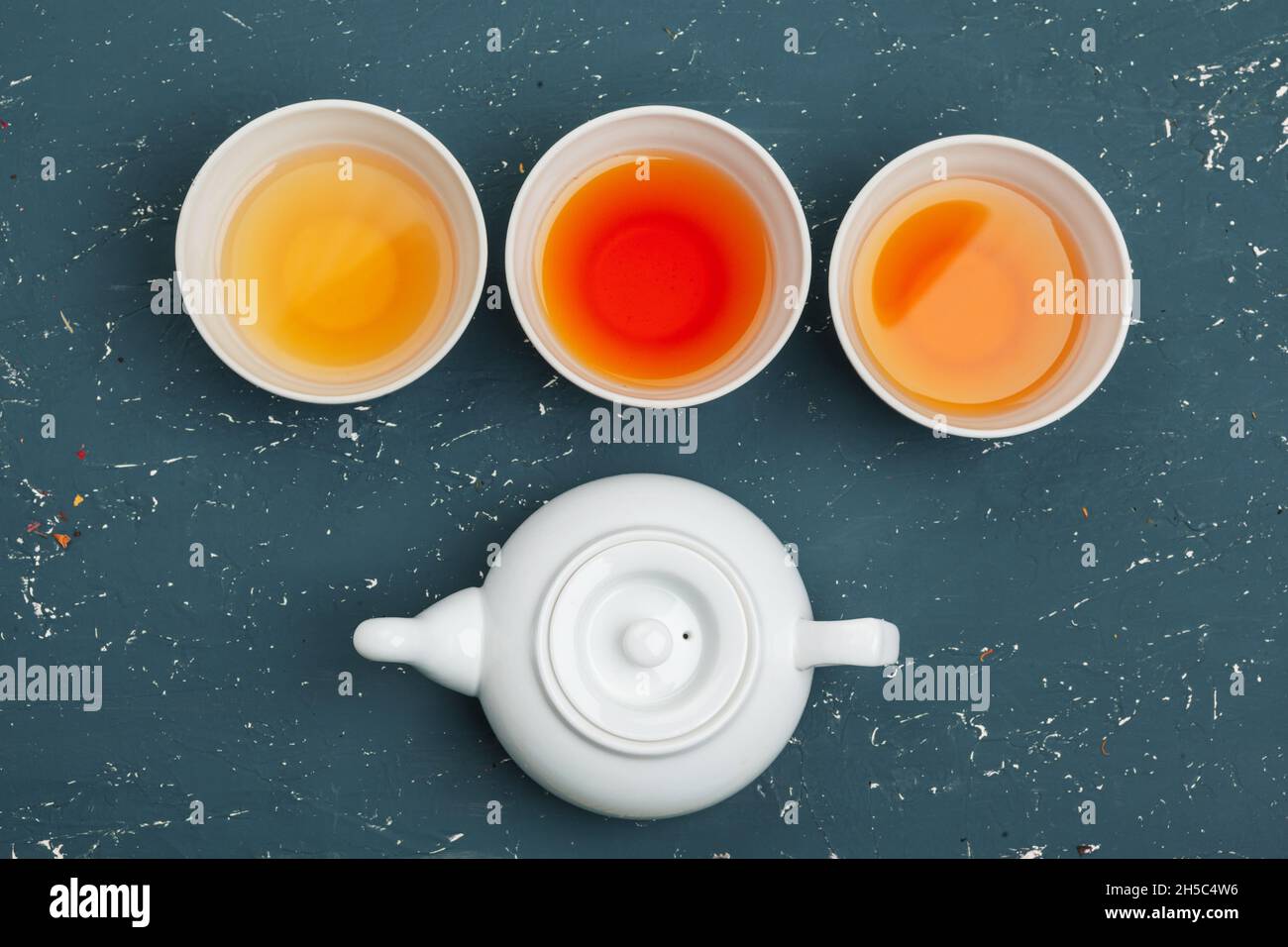 Collection of different teas in cups with tea leaves Stock Photo Alamy