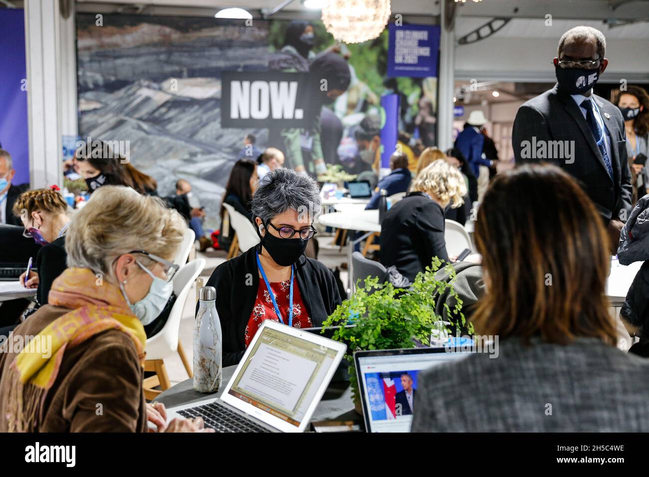 Glasgow, UK. 08th Nov, 2021. Participants work in a common area during the eighth day of the COP26 UN Climate Change Conference, held by UNFCCC inside the COP26 venue - Scottish Event Campus in Glasgow, Scotland on November 8, 2021. COP26, running from October 31 to November to 12 in Glasgow, is the most significant climate conference since the 2015 Paris summit as the nations are expected to set new greenhouse gas emission targets in order to slow the global warming, as well as firming up other key commitments. (Photo by Dominika Zarzycka/Sipa USA) Credit: Sipa USA/Alamy Live News Stock Photo