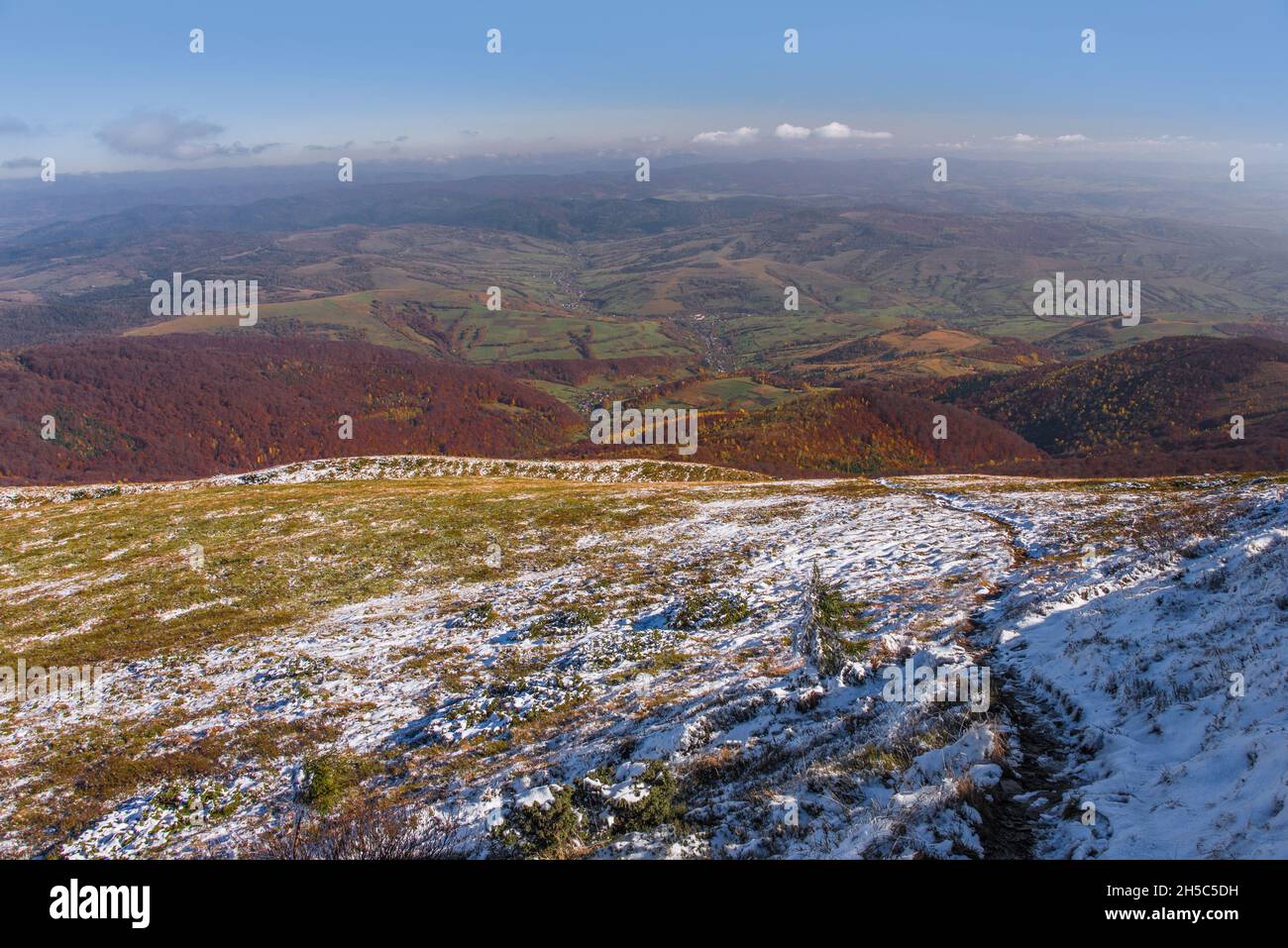 View of hills of Water Dividing ridge covered in red, orange and yellow ...