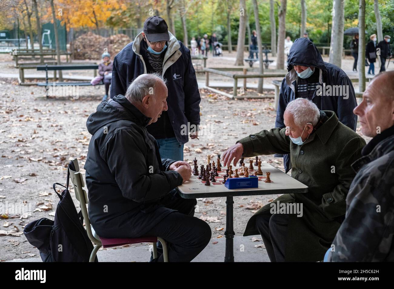 Men play chess in the Jardin du Luxembourg Garden in the 6th