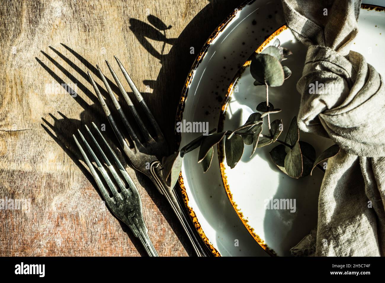 Rustic table setting with Easter eggs for Easter dinner Stock Photo