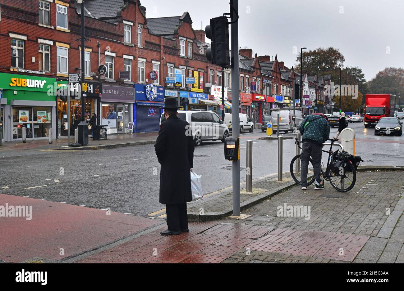 Orthodox Jewish man crossing the in Cheetham Hill, Greater Manchester, Lancashire, Britain, Uk Stock Photo