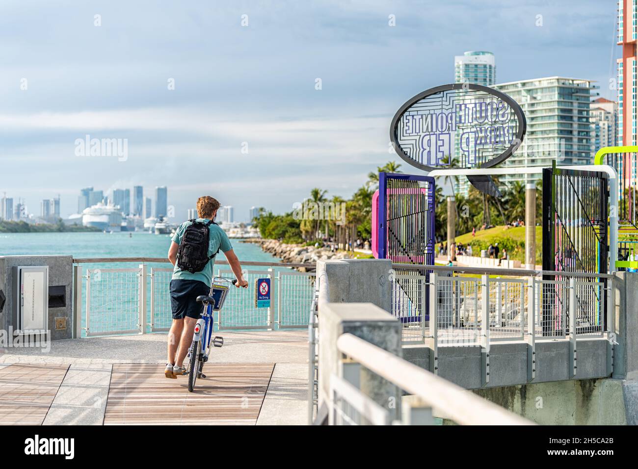 Miami Beach, USA - January 17, 2021: South beach Lummus Park buildings and sign entrance for south pointe park pier on south end of Miami beach with p Stock Photo